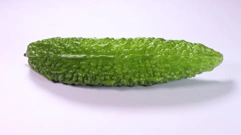 Bitter melon on white background, rotating Stock-Footage 313413453