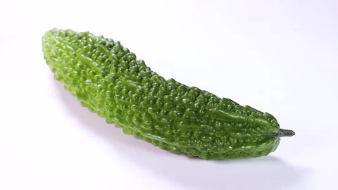 Bitter melon on white background, rotating Stock Footage 313815562