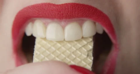 Bitting Waffles with Red Lips a Close up Shot of Female in Slow motion Stock Footage 166003613