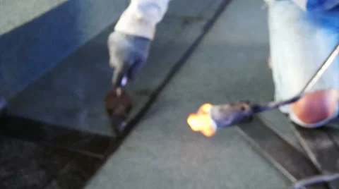Bitumen roofing, asphalt installation with fire Stock-Footage 51156547