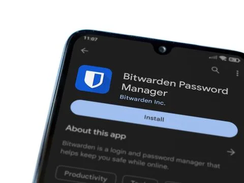 Bitwarden Password Manager app play store page on smartphone on white backg.. Fotos de archivo
