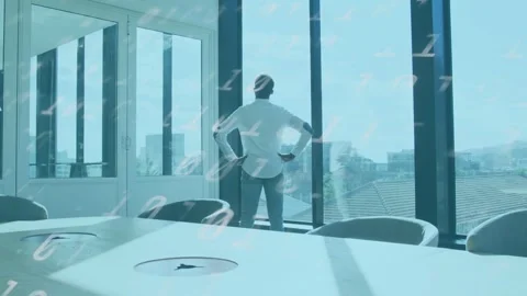Biz exec standing by table at window, data overlay drifting, causing shifting Stock Footage 333414373