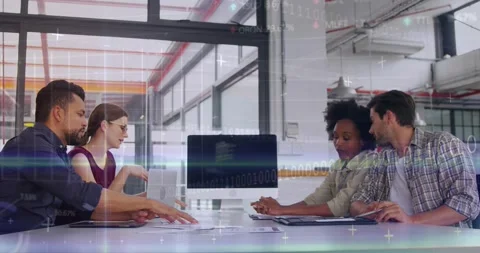 Biz team at table shifting from screen as woman pointing, spreading docs for Stock Footage 333733292