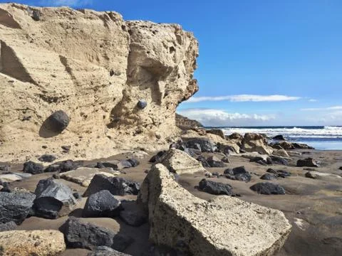 Bizarre beach section on Tenerife equipped with tuff and lava stones Stock Photos