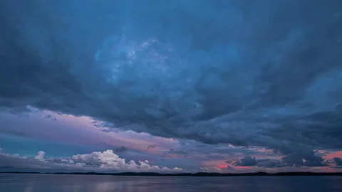 Bizarre bluish clouds shadowing Baltic sea shores Video stock 187472167