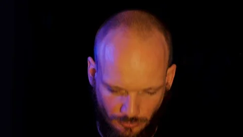 Bizarre feeling : weird bearded man staring at camera then smiling Stock Footage 112021009