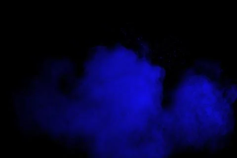 Bizarre forms of  blue powder explode cloud on black background. Stock Photos