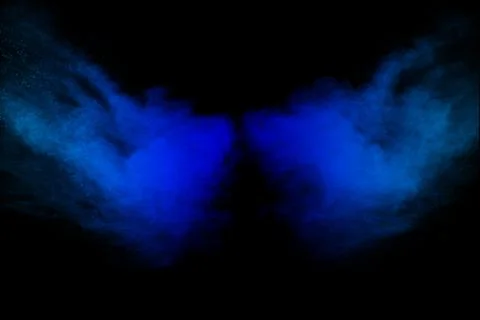Bizarre forms of  blue powder explode cloud on black background. Stock Photos