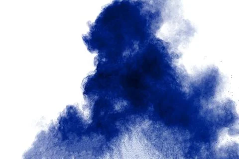 Bizarre forms of blue powder explode cloud on white background. Stock Photos