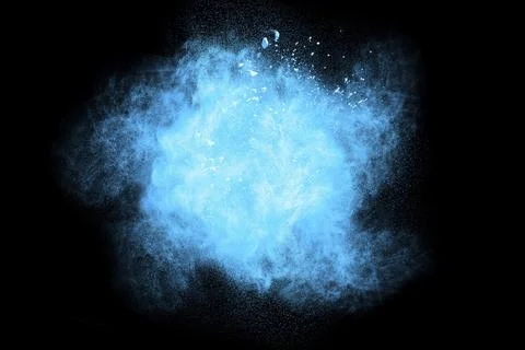Bizarre forms of blue powder explode cloud on background. Launched blue dust Stock Photos