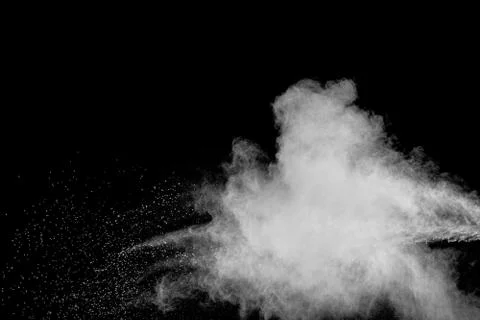 Bizarre forms of white powder explosion cloud against black background. Stock Photos