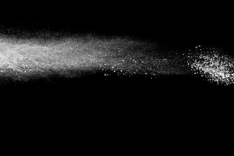 Bizarre forms of white powder explosion cloud against black background. Stock Photos