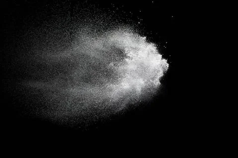 Bizarre forms of white powder explosion cloud against black background.Whi... Foto stock