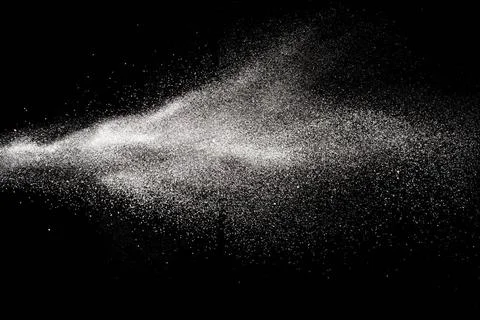 Bizarre forms of white powder explosion cloud against black background.Whi... Foto stock