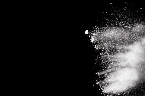 Bizarre forms of white powder explosion cloud against black background.Whit.. Stock Photos
