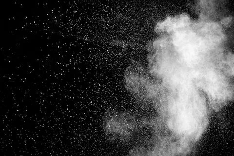 Bizarre forms of white powder explosion cloud against black background.Whit.. Stock Photos