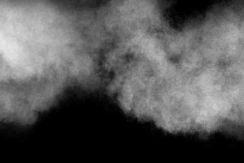 Bizarre forms of white powder explosion cloud against black background. Stock Photos