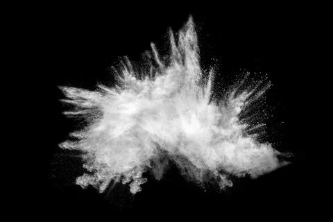Bizarre forms of white powder explosion cloud against black background.Whit.. Stock Photos