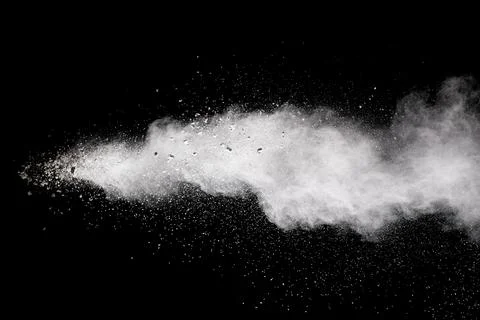 Bizarre forms of white powder explosion cloud against black background.Whit.. Stock Photos