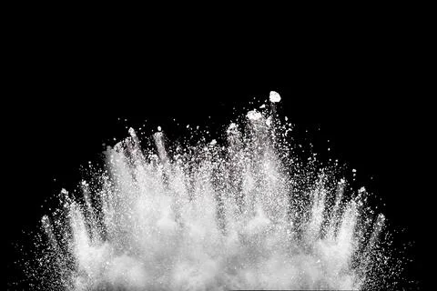 Bizarre forms of white powder explosion cloud against black background.Whit.. Stock Photos