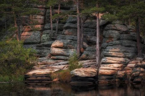 Bizarre rocks on shore of the mystical Devil Lake Shaitankol in Karkaraly N.. Stock Photos