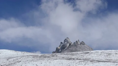 Bizarre Rocks Snow Clouds Mountains Peak 4k Video stock 89842683