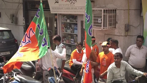 BJP supporters with BJP flags during political campaign Stock Footage 348049198