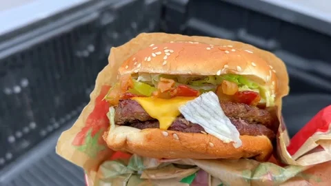 BK Double Whopper with Cheese and Bacon Food Review Stock Footage 341672560