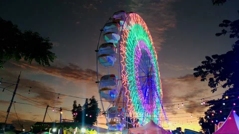 BKT Ferris wheel sunset sky colorfull Stock Footage 234845029