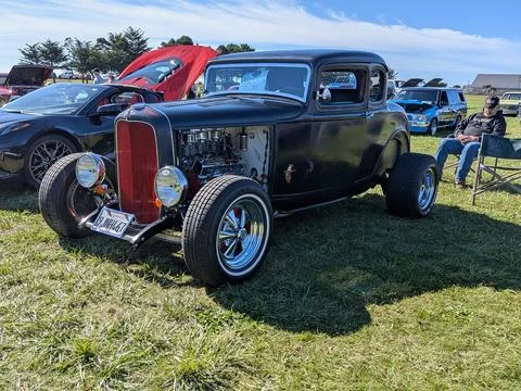 Black 1932 Ford 3-Window Coupe hot rod with visible side engine Photos