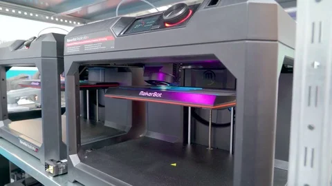 A black 3d printer on the booth of a company Video stock 75709317