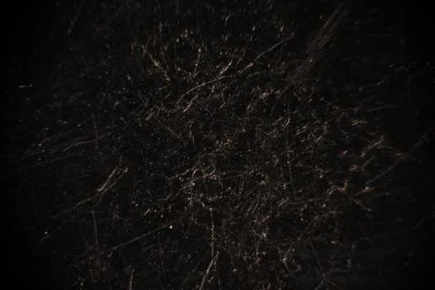 Black abstract background with multiple light scratches. Foto stock