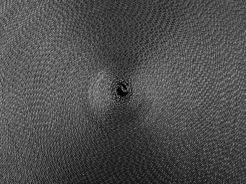 Black abstract circular pattern made of black sling Stockfoto's