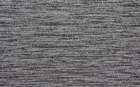 A black abstract surface with small silvery horizontal stripes and a scatteri Stock Photos
