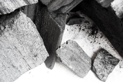 Black abstract textured composition on a white background, a selected focus c Stock Photos