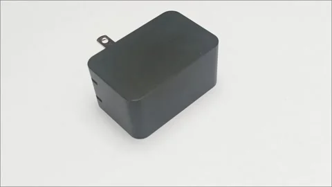 Black AC DC Power Adapter Wall Charger on White Background Video stock 336472916