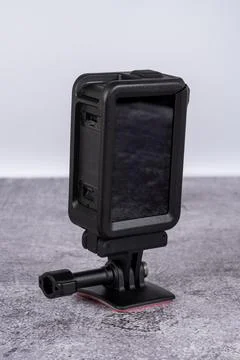 Black action camera front view placed on the table Stock Photos