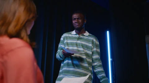 Black Actor Rehearsing Scene with Script during Theater Class Stock Footage 344523254