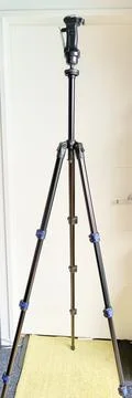 Black adjustable tripod stand and mounted support head Stock Photos