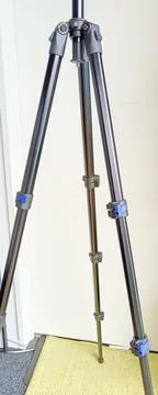 Black adjustable tripod stand and mounted support head Stock Photos