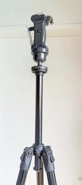 Black adjustable tripod stand and mounted support head Stock Photos