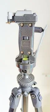 Black adjustable tripod stand and mounted support head Stock Photos