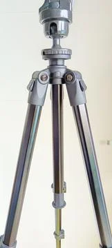 Black adjustable tripod stand and mounted support head Stock Photos