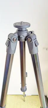 Black adjustable tripod stand and mounted support head Stock Photos