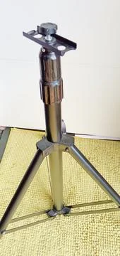 Black adjustable tripod stand and mounted support head Stock Photos