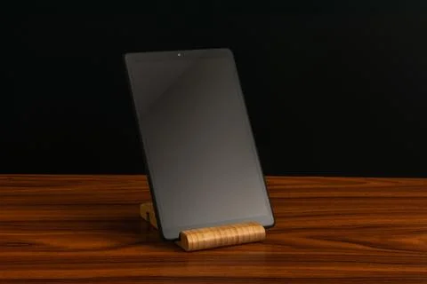 Black advanced smart home control panel mounted on a wooden base and dark b.. Stock Photos