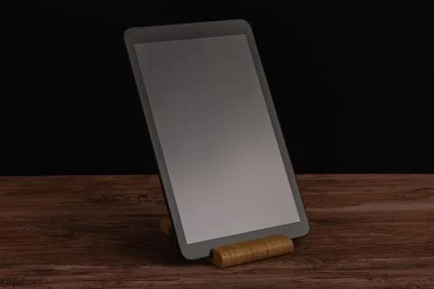 Black advanced smart home control panel mounted on a wooden base and dark b.. Stock Photos