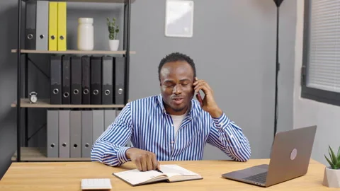 Black African American Man Using Smartphone at office Video stock 276835108