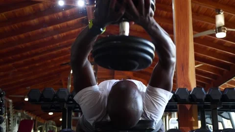Black african american man on workout bench weight lifting. Fitness workout  Stock Footage