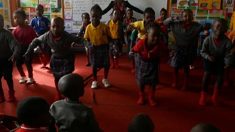 Black African boys are practicing dance and rehearsing for their friends Stock Footage 98090128